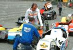 Jean Hergott/Gerald Midrouet's sidecar being filled with petrol at the TT Grandstand, Douglas.