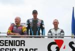 Chris Palmer on the winners podium at the TT Grandstand (on right).