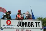 John McGuinness (middle) celebrates with Champagne.