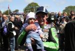 Ryan Farquhar and daughter in the winners' enclosure at the TT Grandstand.