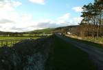 Road to Knockaloe Farm.<br> Once was a Rail Track.<br> Meat Houses can be seen on right side.