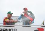 Ryan Farquhar on the winners podium at the TT Grandstand.