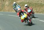 Rob Colvin (number 56) at Signpost Corner, Onchan.