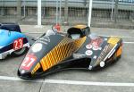 Conrad Harrison/Dan Toone's sidecar at the TT Grandstand, Douglas.