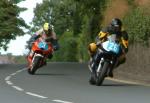 Ian Hickey (number 26) on Bray Hill, Douglas.