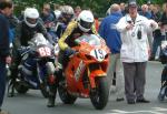 Ian Hutchinson (number 19) leaving TT Grandstand.