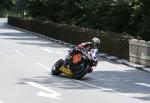 John McGuinness approaching Braddan Bridge.