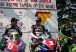 Bruce Anstey (3) in the winners' enclosure at the TT Grandstand.