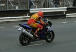 Tom Clucas passing TT Grandstand, Douglas.