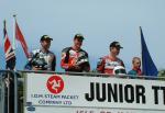 John McGuinness (middle) after winning the Junior TT.