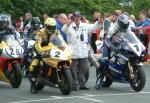 Ian Lougher (number 2) leaving TT Grandstand.