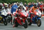 John McGuinness (number 3) leaving TT Grandstand.