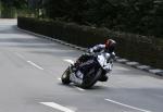 Daniel Kneen approaching Braddan Bridge.