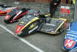 Dave Molyneux/Daniel Sayle's sidecar at the TT Grandstand.