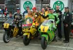 Davy Morgan (middle) celebrating after winning the Senior Manx Grand Prix.