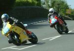 Matt Bailey (number 60) at Signpost Corner, Onchan.