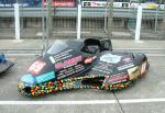 John Saunders/Colin Smith's sidecar at the TT Grandstand, Douglas.