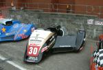 Peter Nuttall/Geoff Smale's sidecar at the TT Grandstand, Douglas.