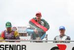 Ryan Farquhar on the winners podium at the TT Grandstand.